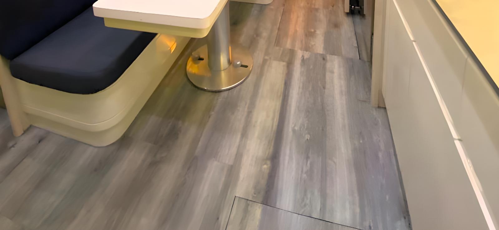 a wood floor with a chair aboard ESCAPE MANA Yacht for Sale