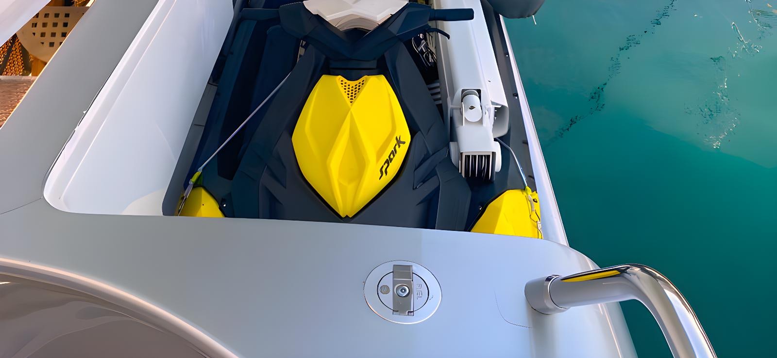a yellow and black padlock on a white surface aboard ESCAPE MANA Yacht for Sale