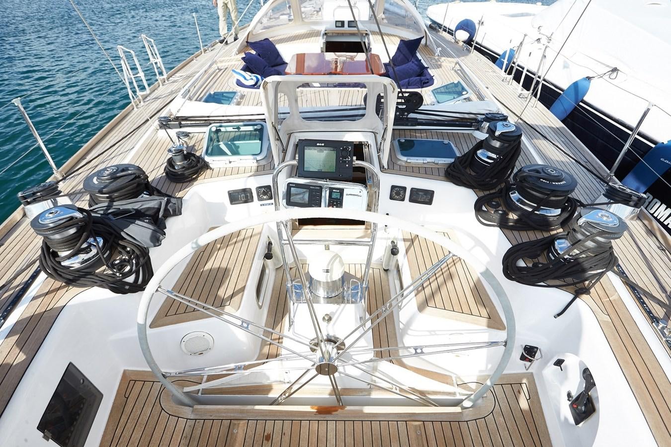 a boat with a steering wheel aboard FAR OUT Yacht for Sale