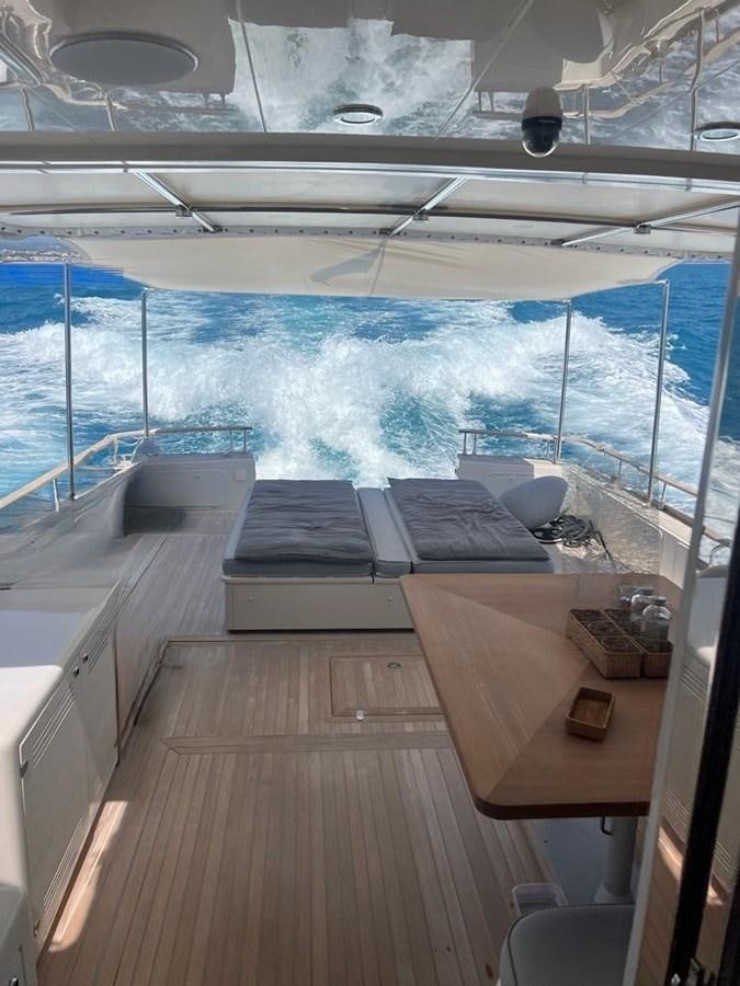 a deck with a view of the water and the deck aboard NOI TOY Yacht for Sale