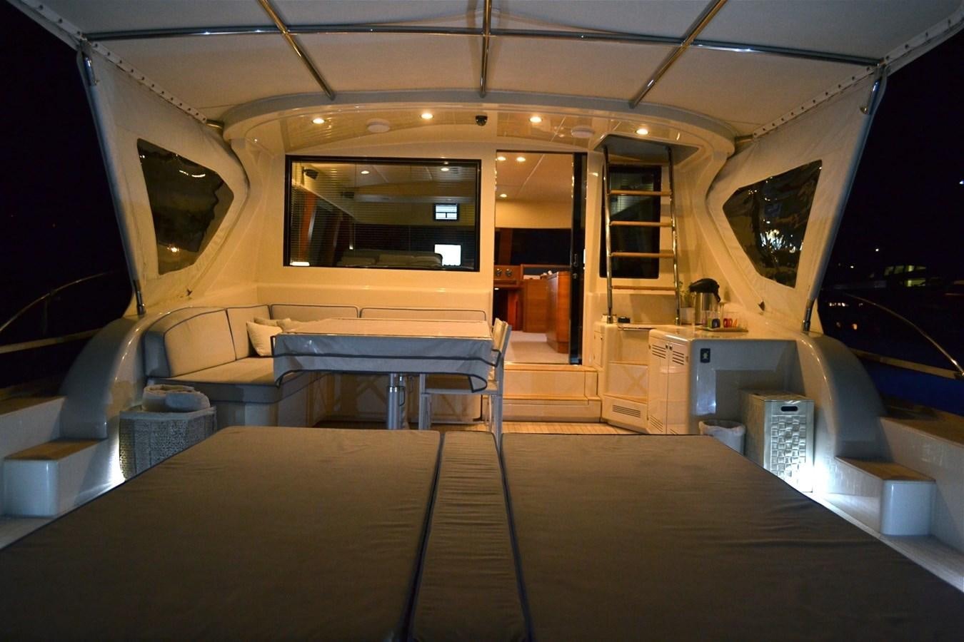 a room with a table and chairs aboard NOI TOY Yacht for Sale