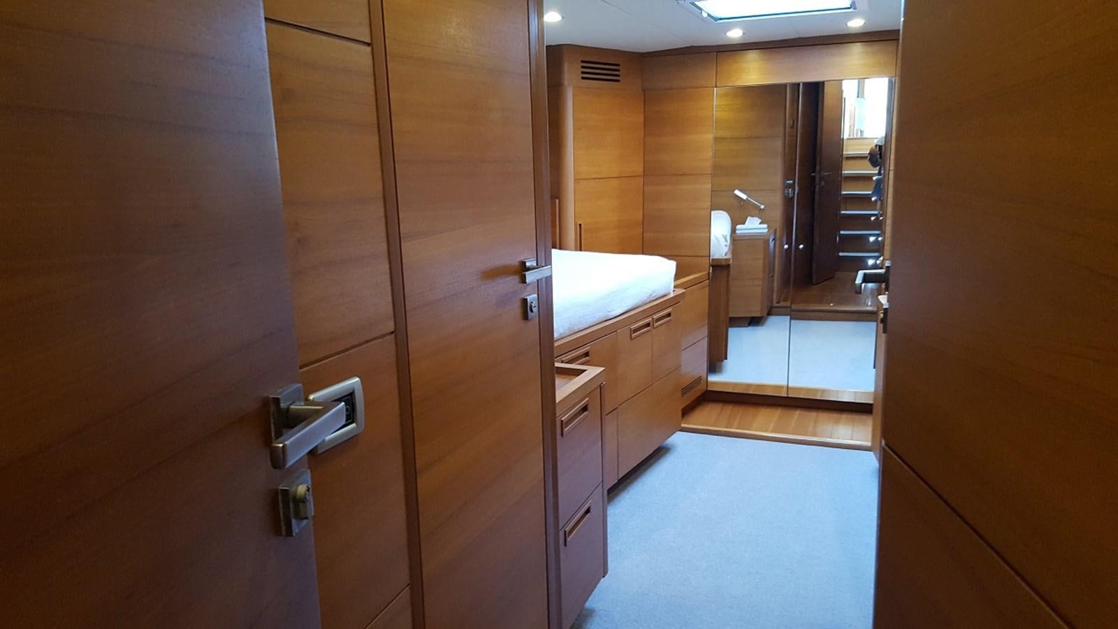 a bathroom with a wood door aboard NOI TOY Yacht for Sale
