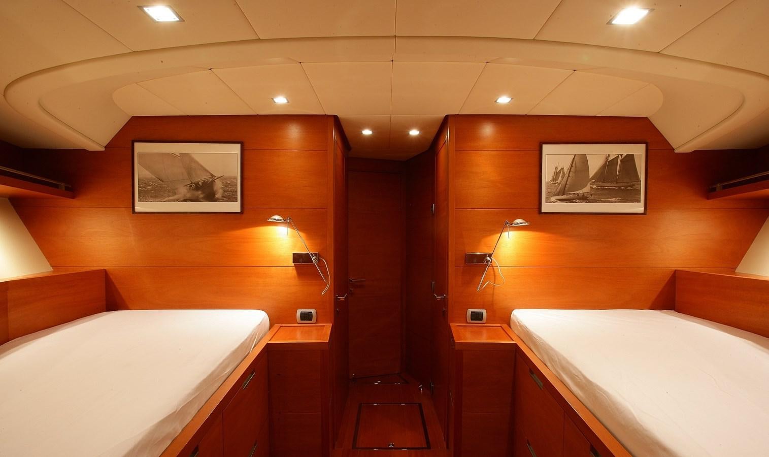 a room with a bed and a mirror aboard NOI TOY Yacht for Sale