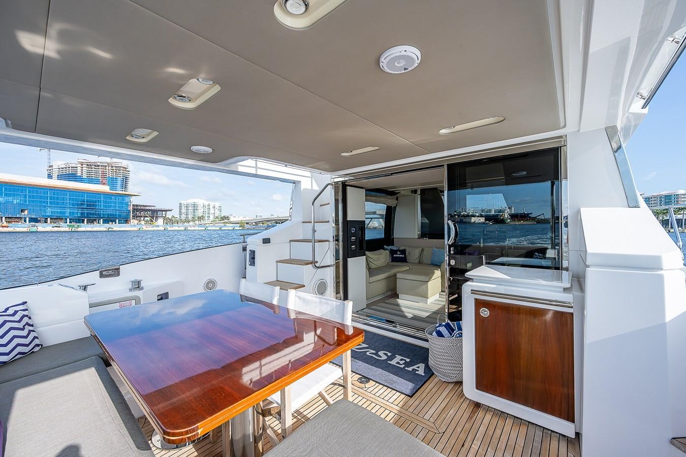 a room with a table and a bed aboard FITZ SEA Yacht for Sale