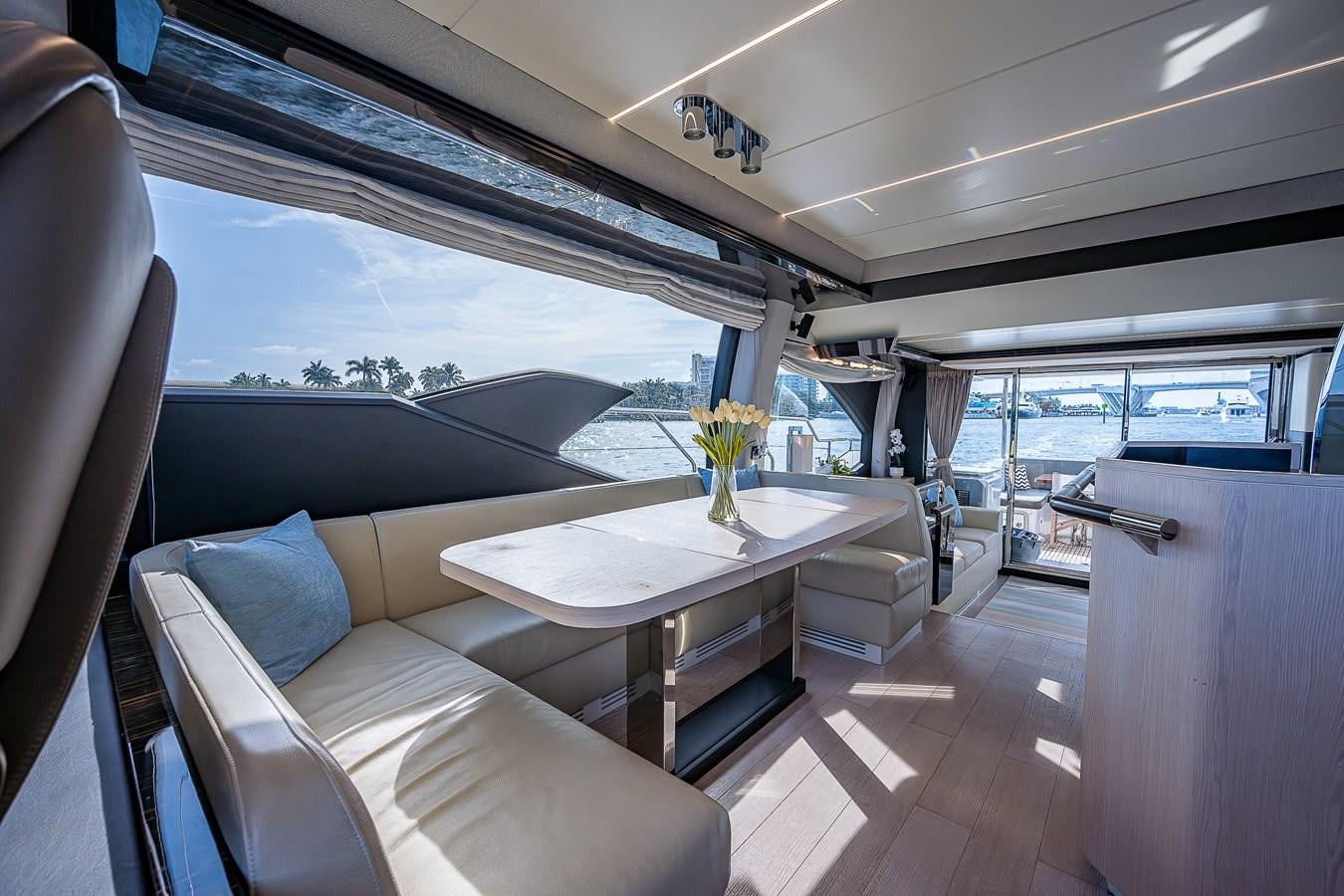 a table and chairs in a bus aboard FITZ SEA Yacht for Sale
