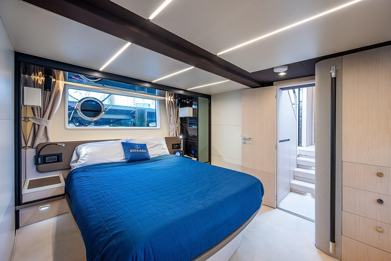 a bedroom with a bed and a television aboard FITZ SEA Yacht for Sale