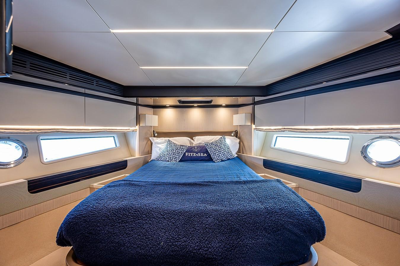 a room with a bed and a window aboard FITZ SEA Yacht for Sale