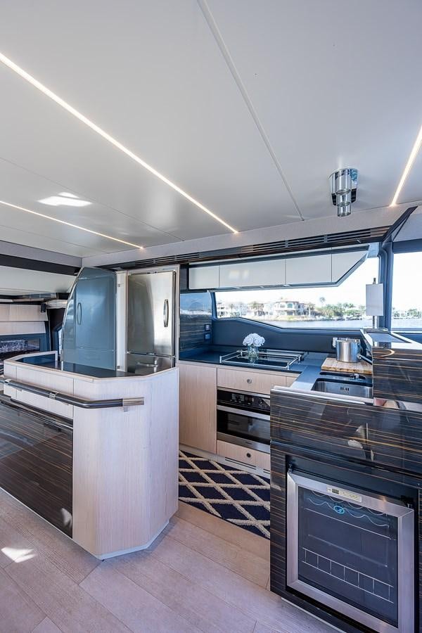 a kitchen with a large window aboard FITZ SEA Yacht for Sale