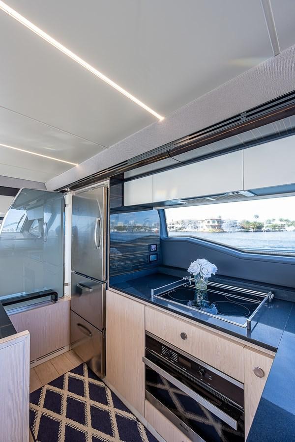 a kitchen with a glass wall aboard FITZ SEA Yacht for Sale