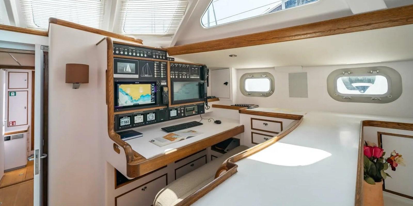a room with a desk and a tv aboard ALTAIR Yacht for Sale