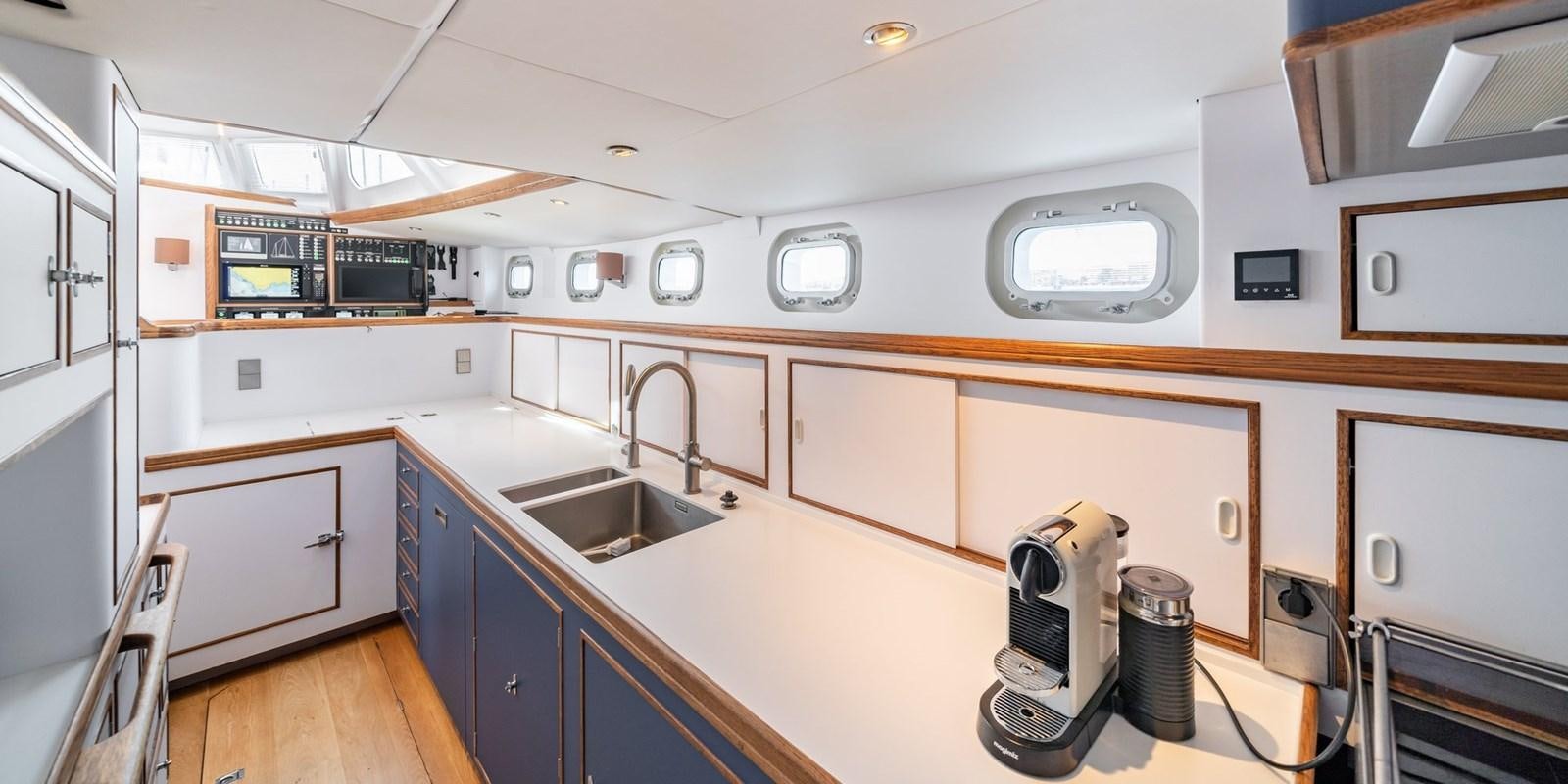 a kitchen with a sink and cabinets aboard ALTAIR Yacht for Sale