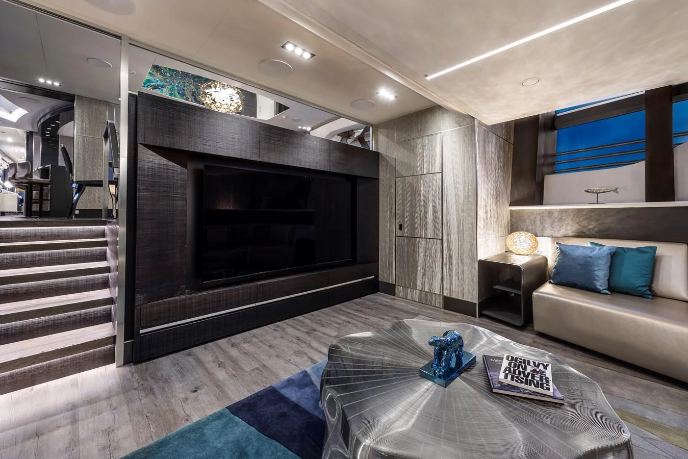 a living room with a fireplace aboard CHORUSLINE Yacht for Sale