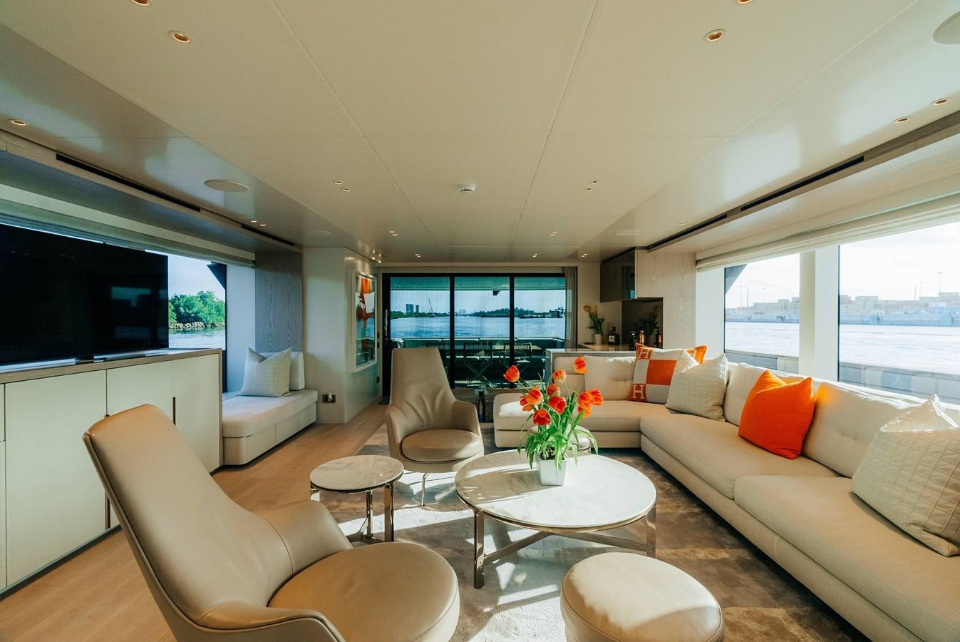 a living room with a couch and a table aboard PEARL Yacht for Sale