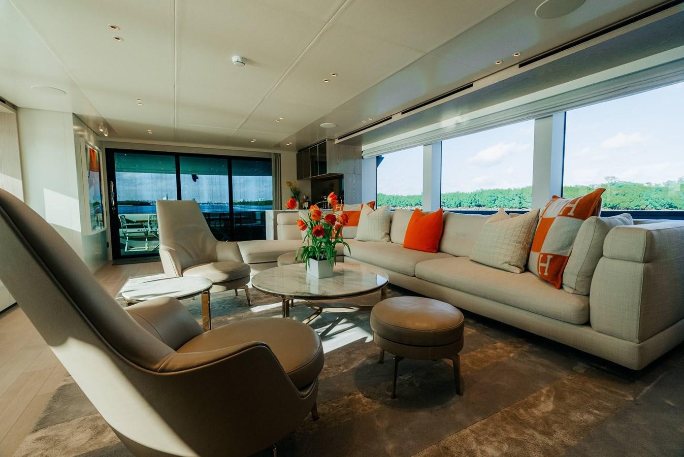 a living room with a couch and a coffee table aboard PEARL Yacht for Sale