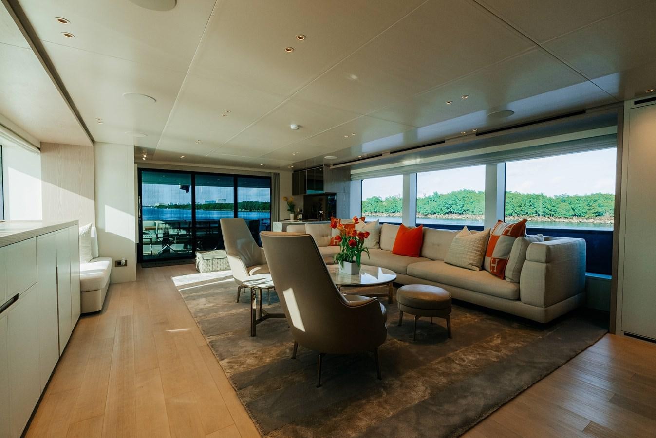 a living room with a large window aboard PEARL Yacht for Sale