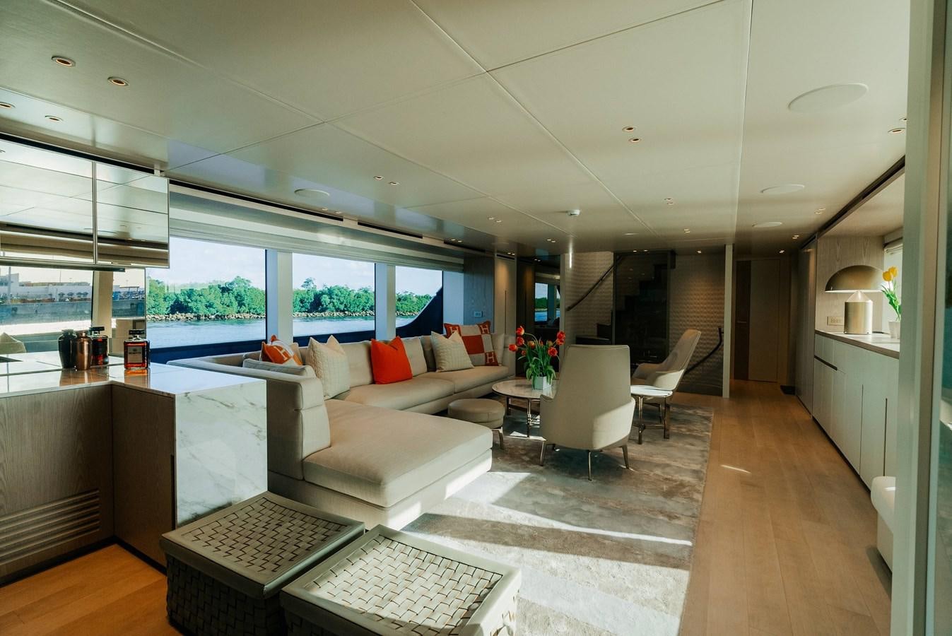 a living room with a large window aboard PEARL Yacht for Sale