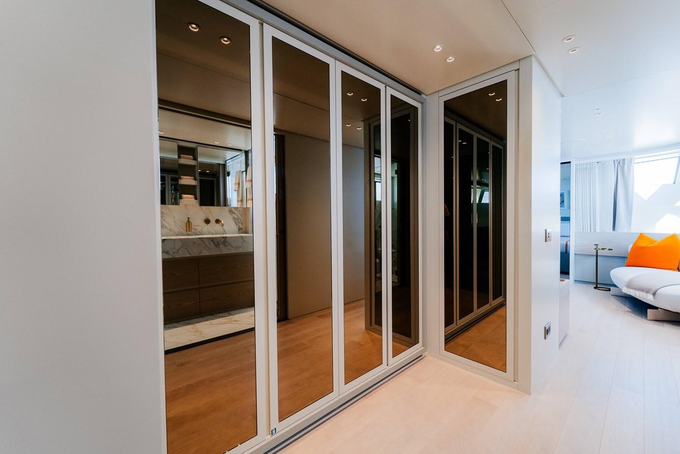 a room with glass doors aboard PEARL Yacht for Sale
