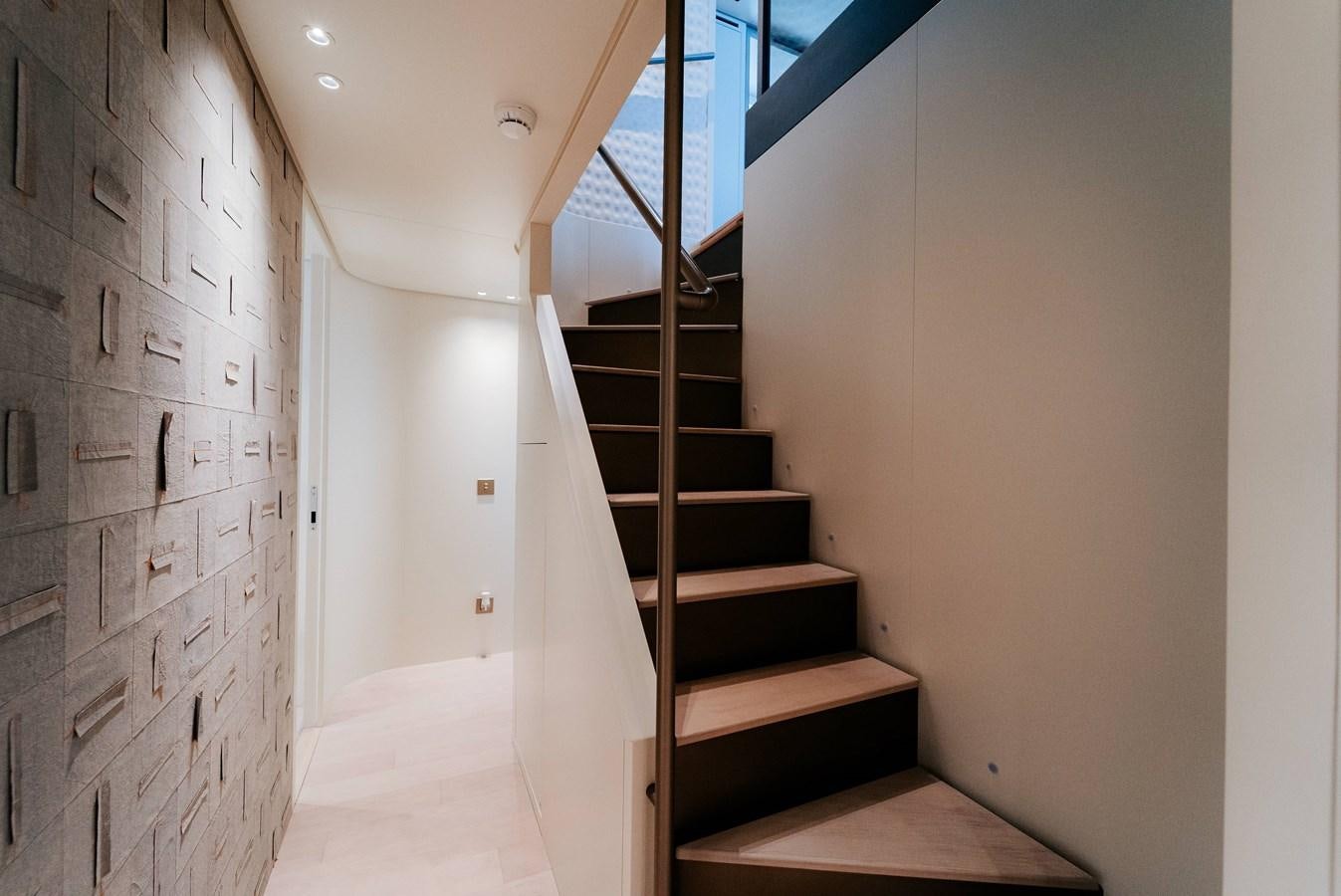 a staircase in a building aboard PEARL Yacht for Sale