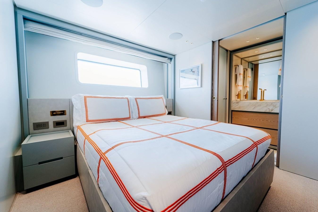 a bedroom with a bed aboard PEARL Yacht for Sale