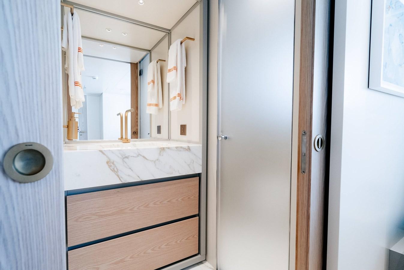 a bathroom with a mirror aboard PEARL Yacht for Sale