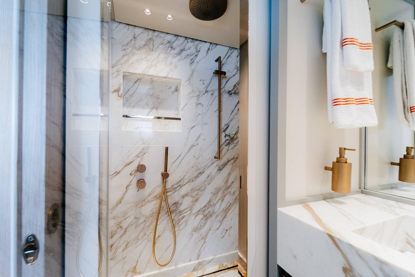 a bathroom with a shower curtain aboard PEARL Yacht for Sale
