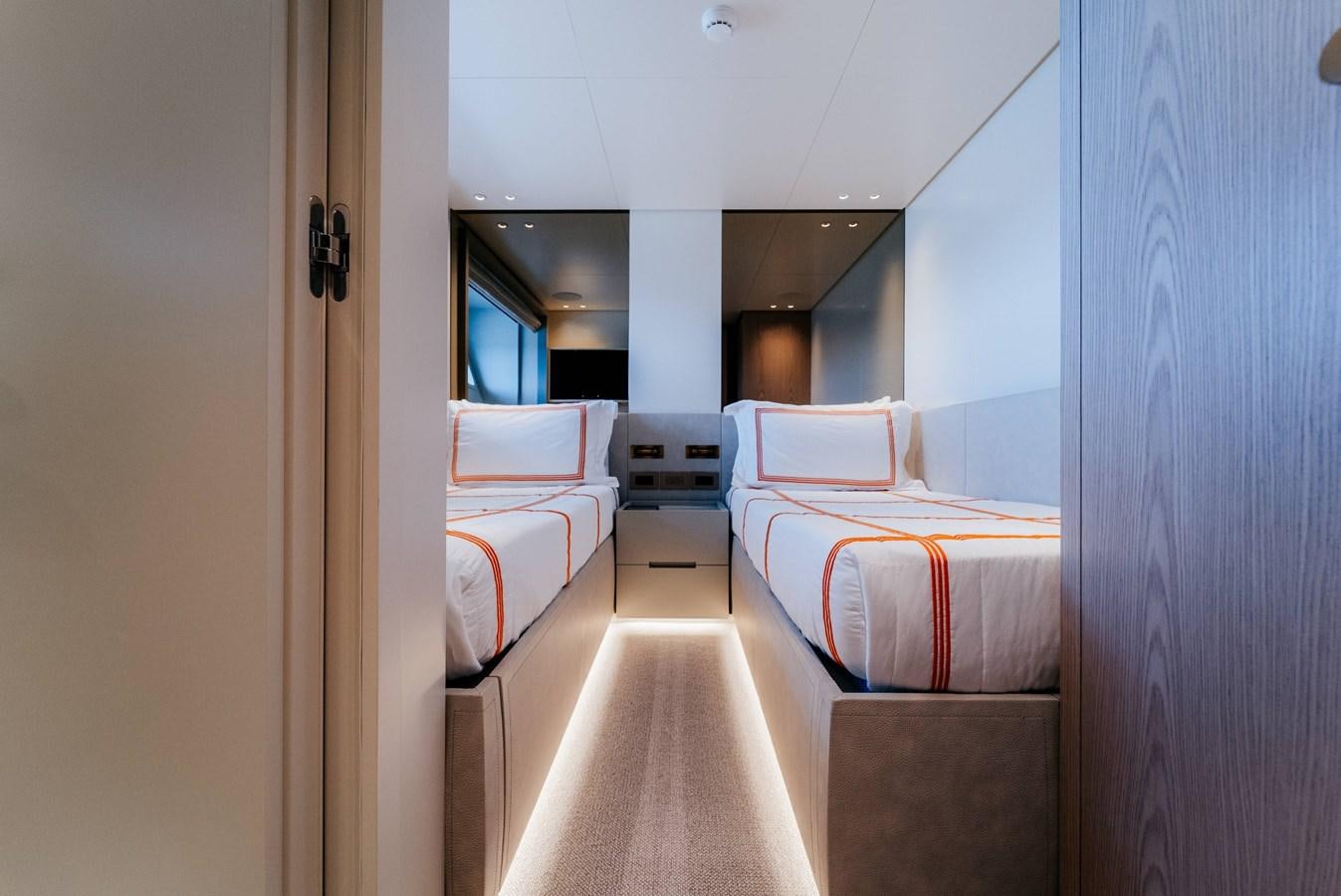 a room with a bed and a window aboard PEARL Yacht for Sale