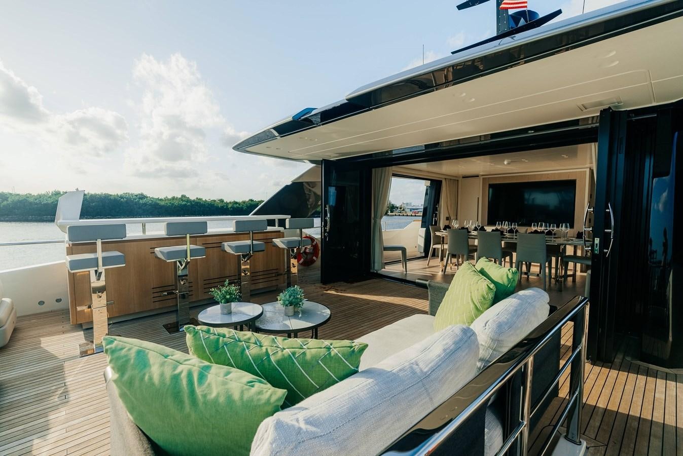 a room with a couch and a table and chairs aboard PEARL Yacht for Sale