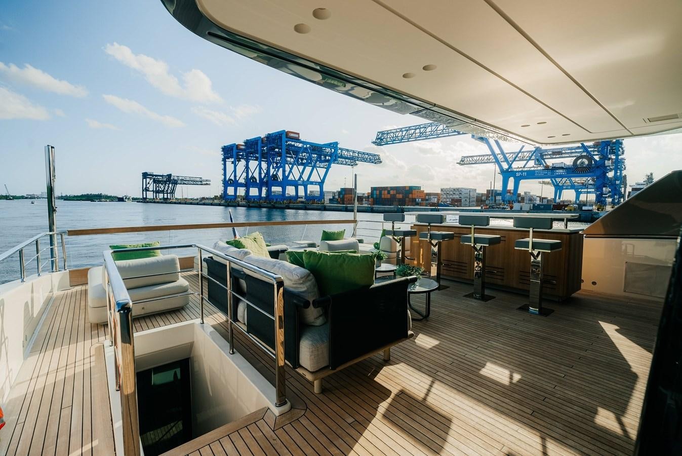 a deck with a large cruise ship in the background aboard PEARL Yacht for Sale