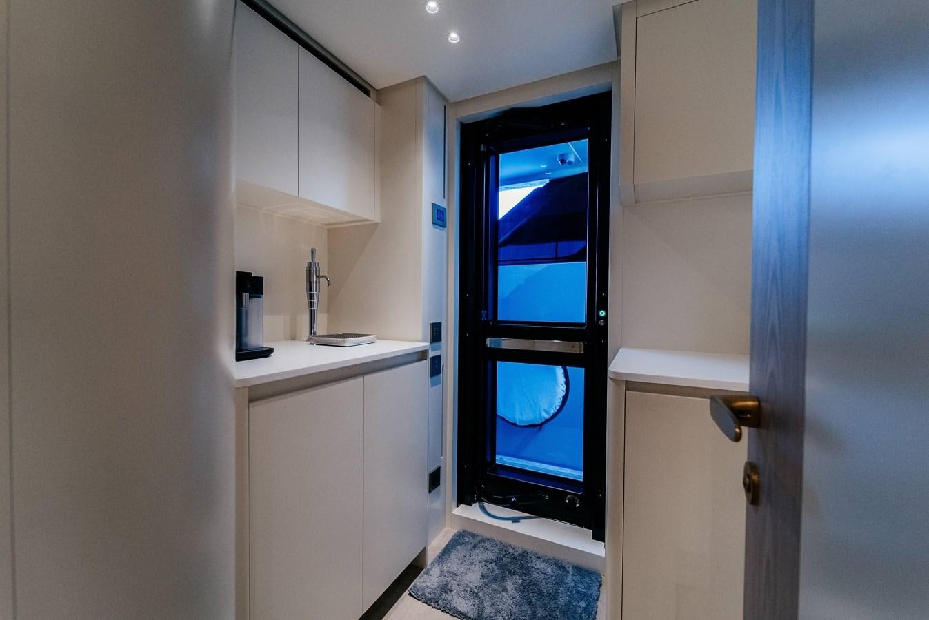 a room with a sink and a tv aboard PEARL Yacht for Sale