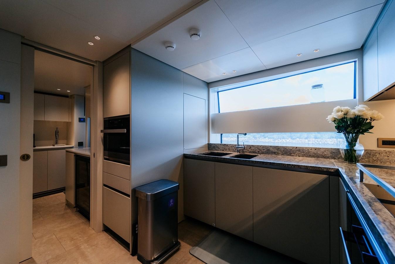 a kitchen with a large island aboard PEARL Yacht for Sale