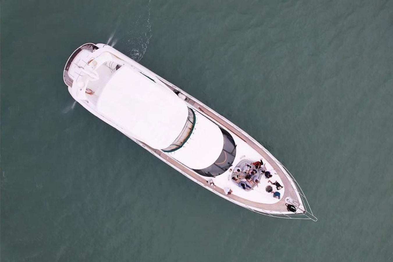 a white surfboard on a green surface aboard ARTENGO Yacht for Sale