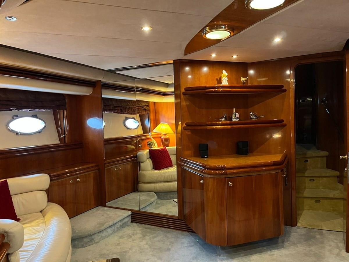 a room with a wood cabinet and a couch and a wood cabinet aboard ARTENGO Yacht for Sale