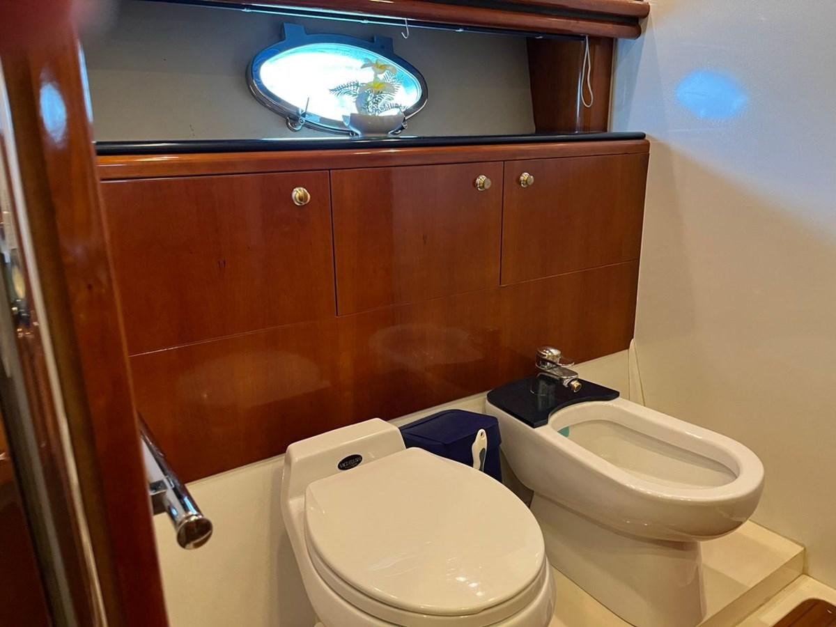 a bathroom with a toilet and a sink aboard ARTENGO Yacht for Sale