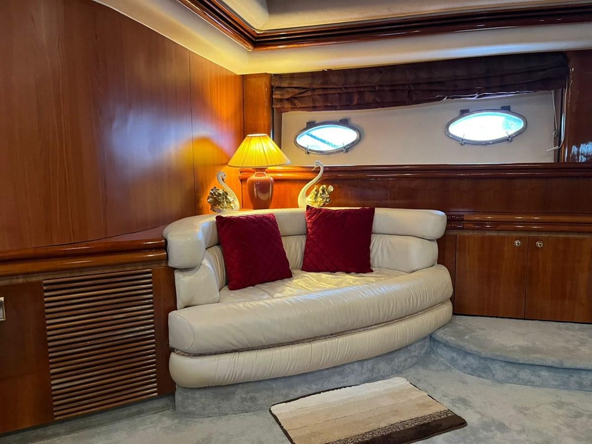 a living room with a couch and a fireplace aboard ARTENGO Yacht for Sale
