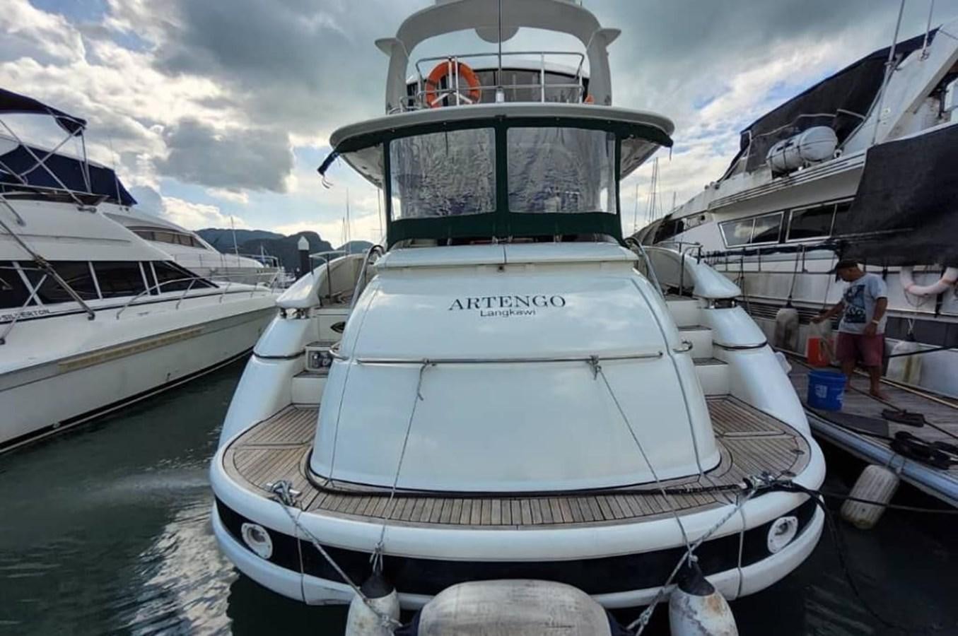 a boat docked at a pier aboard ARTENGO Yacht for Sale