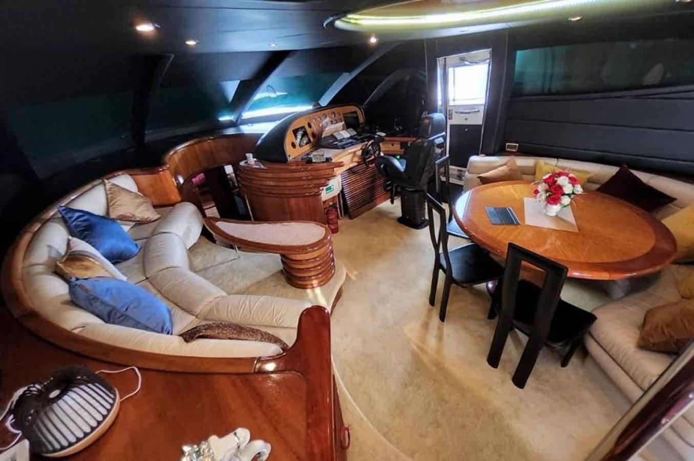 a living room with a couch and a table aboard ARTENGO Yacht for Sale