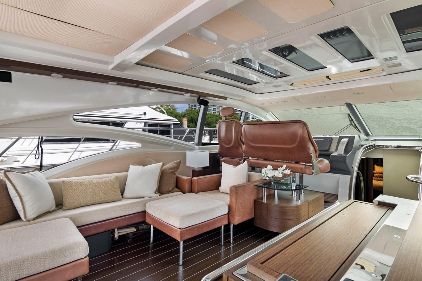 a living room with a couch and a table aboard BLIND SQUIRREL Yacht for Sale