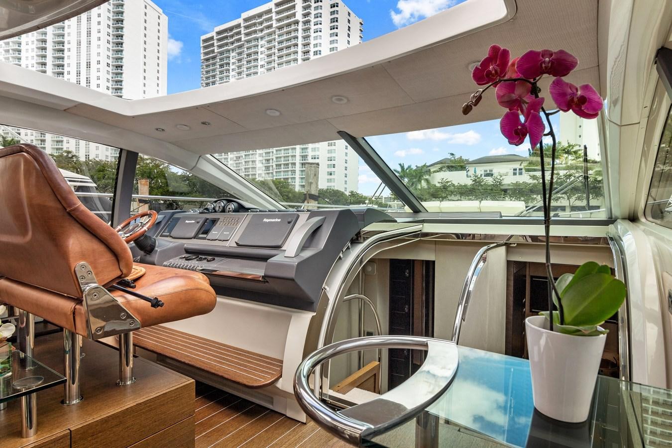 a desk with a laptop and a plant on it aboard BLIND SQUIRREL Yacht for Sale