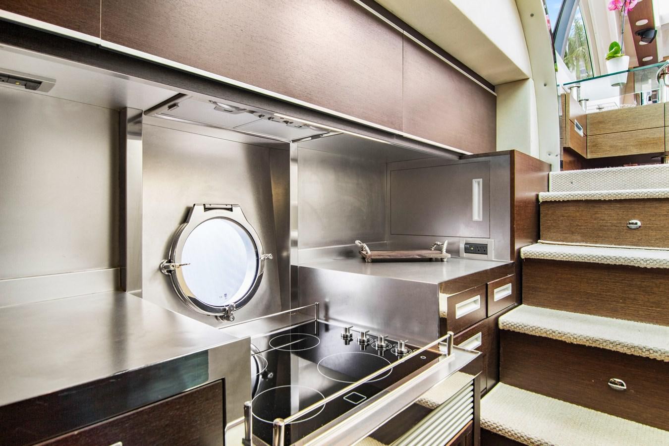a kitchen with a large round mirror aboard BLIND SQUIRREL Yacht for Sale