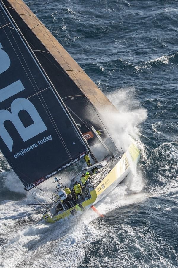 a boat crashing on the water aboard VOLVO OCEAN 65 Yacht for Sale