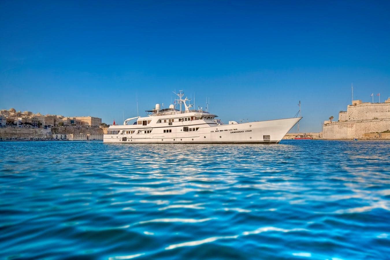 a large white boat in the water aboard SANSSOUCI STAR Yacht for Sale