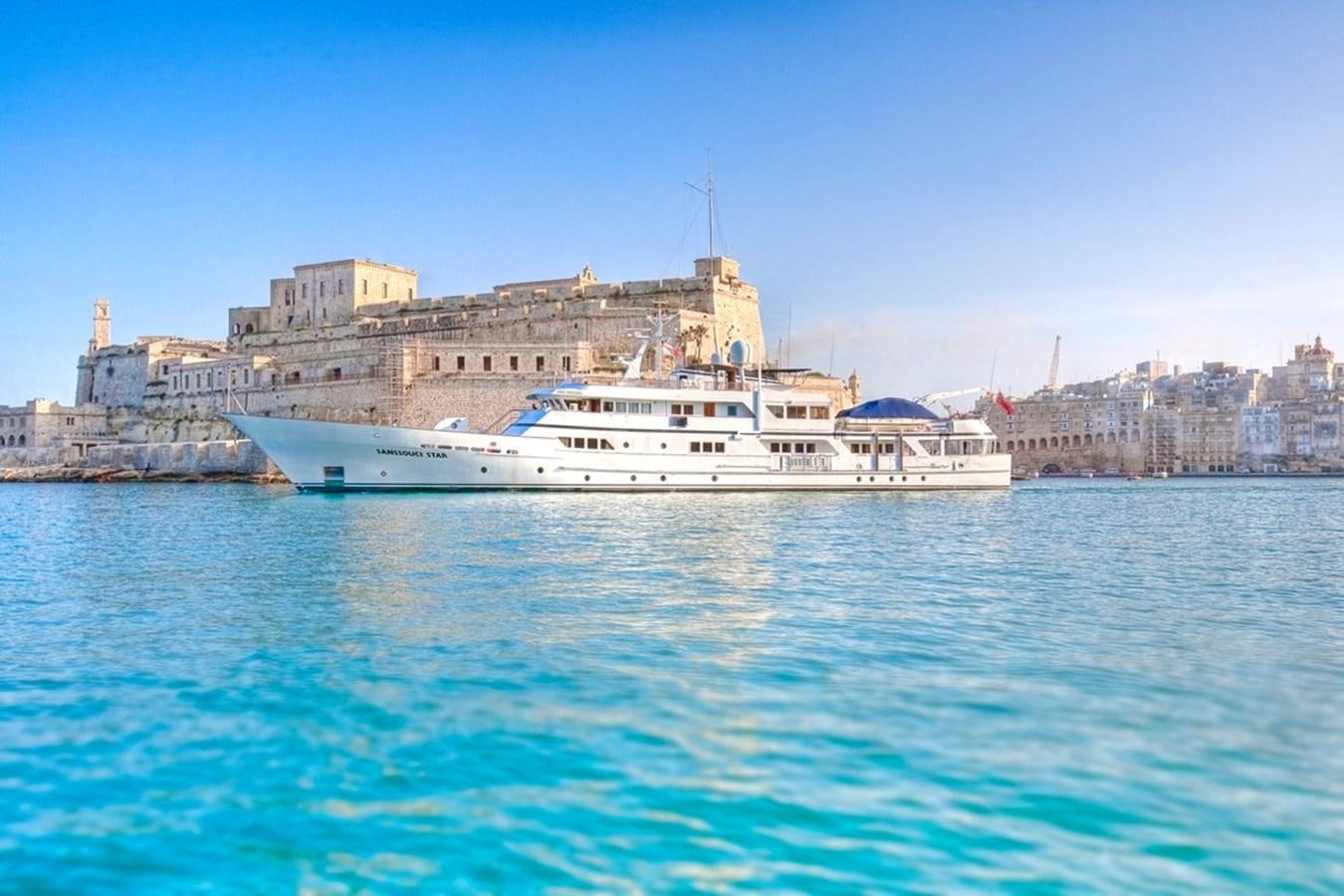 a large white boat in the water aboard SANSSOUCI STAR Yacht for Sale