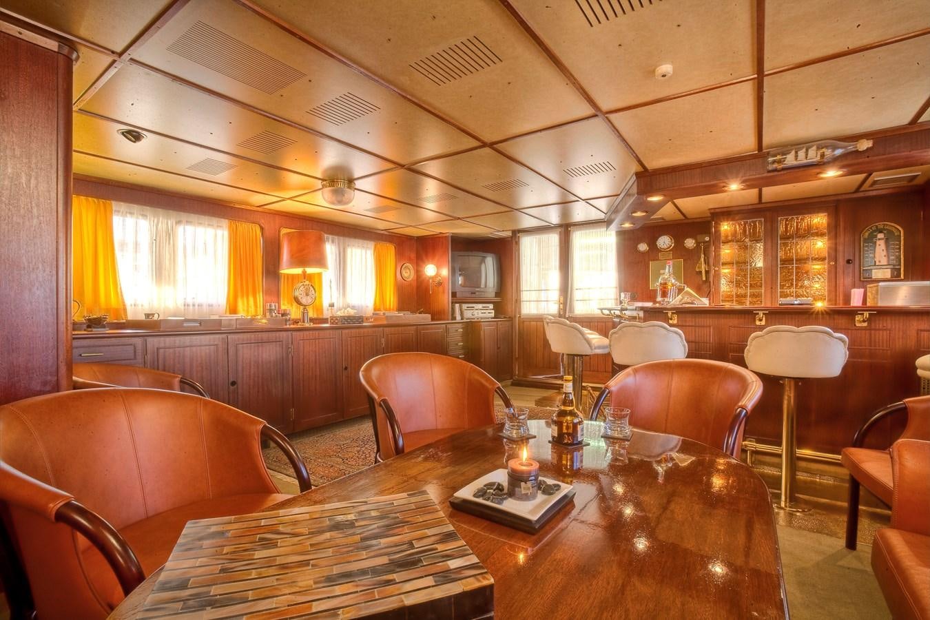 a room with a table and chairs aboard SANSSOUCI STAR Yacht for Sale
