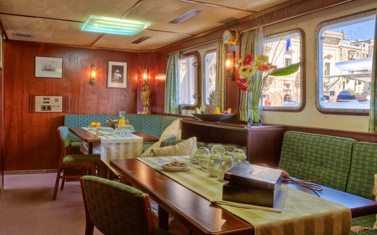 a room with a table and chairs aboard SANSSOUCI STAR Yacht for Sale