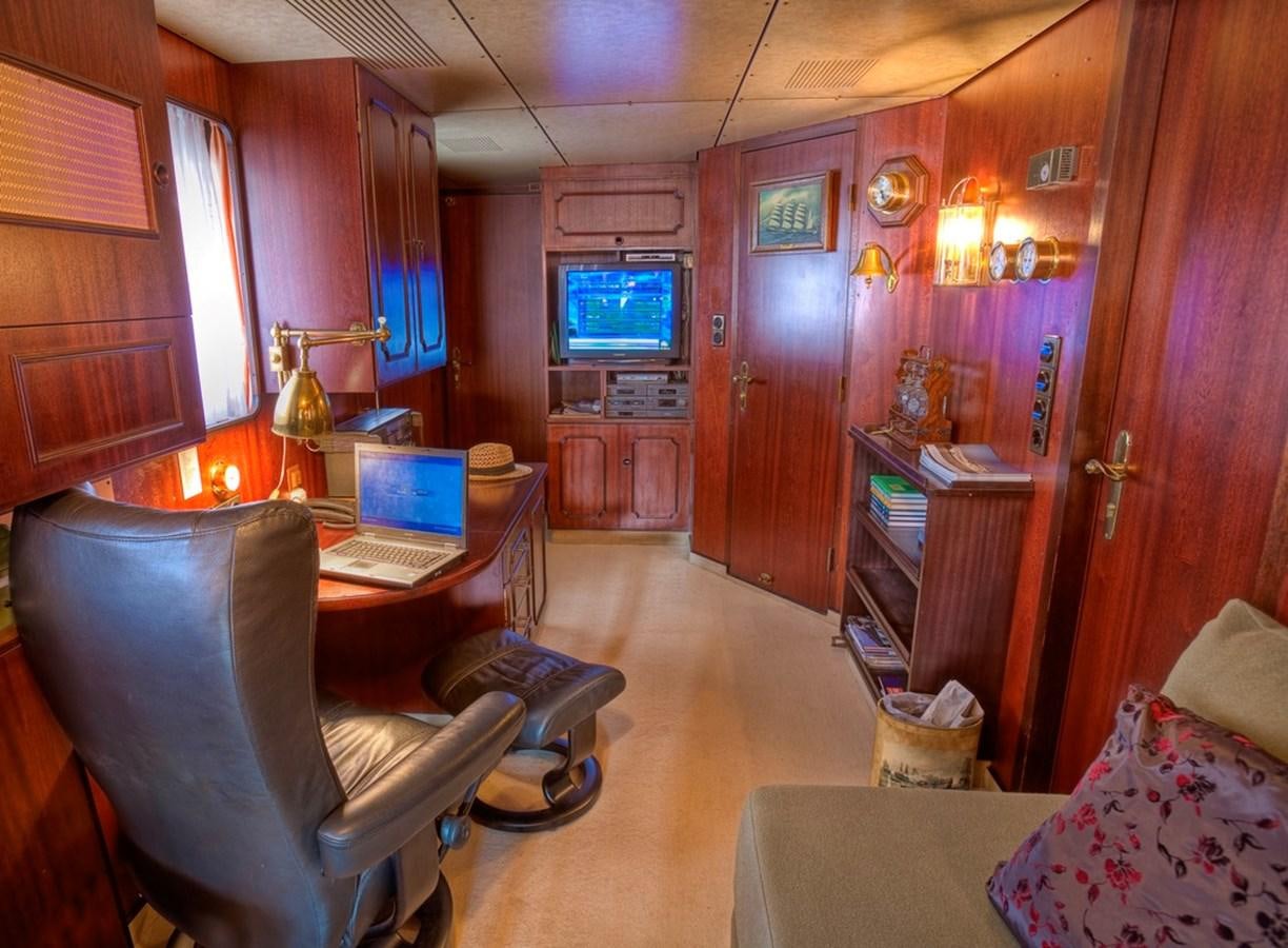 a living room with a tv and a laptop aboard SANSSOUCI STAR Yacht for Sale
