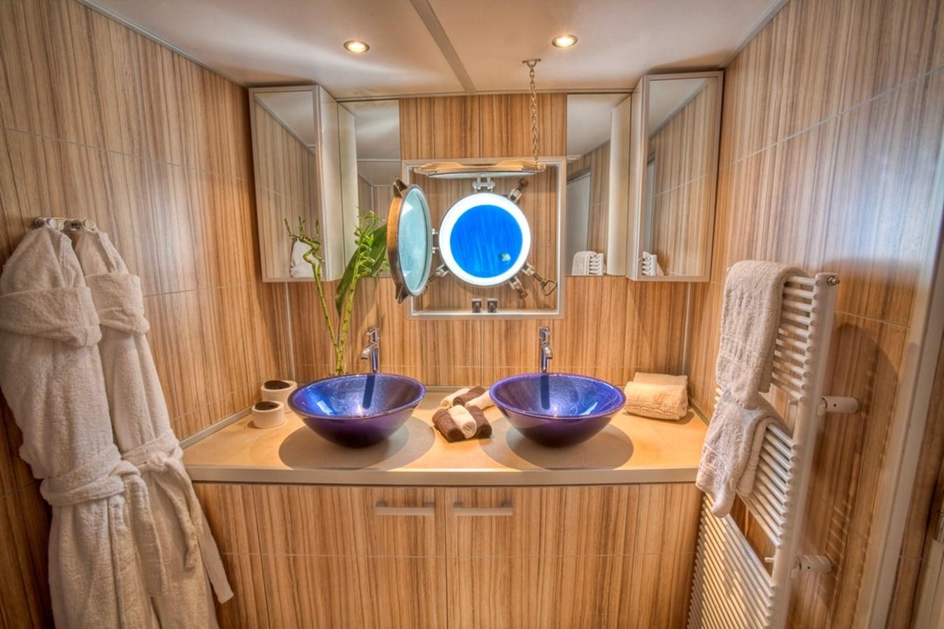 a bathroom with a sink and a mirror aboard SANSSOUCI STAR Yacht for Sale
