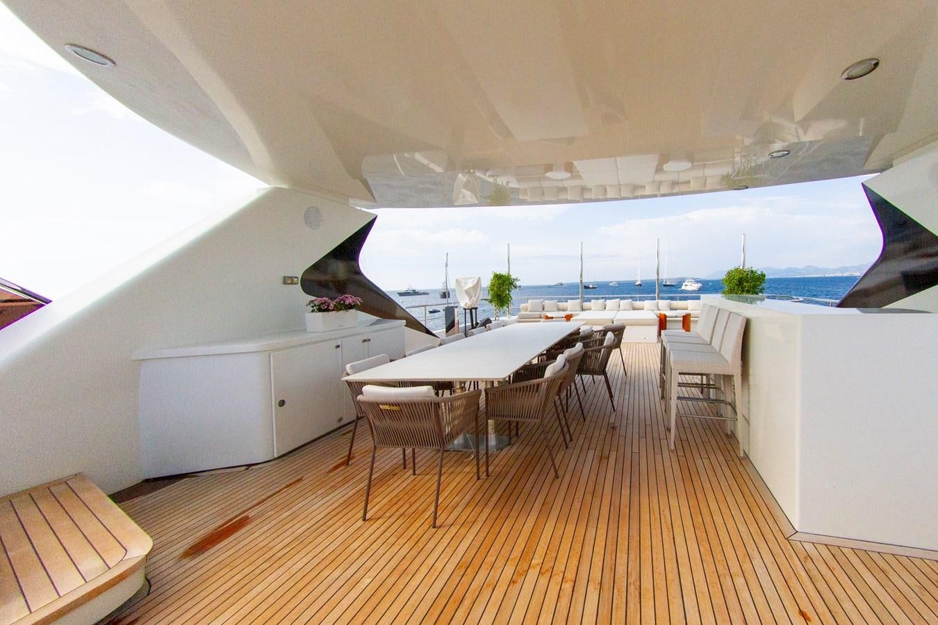 a room with a table and chairs aboard DARLING Yacht for Sale
