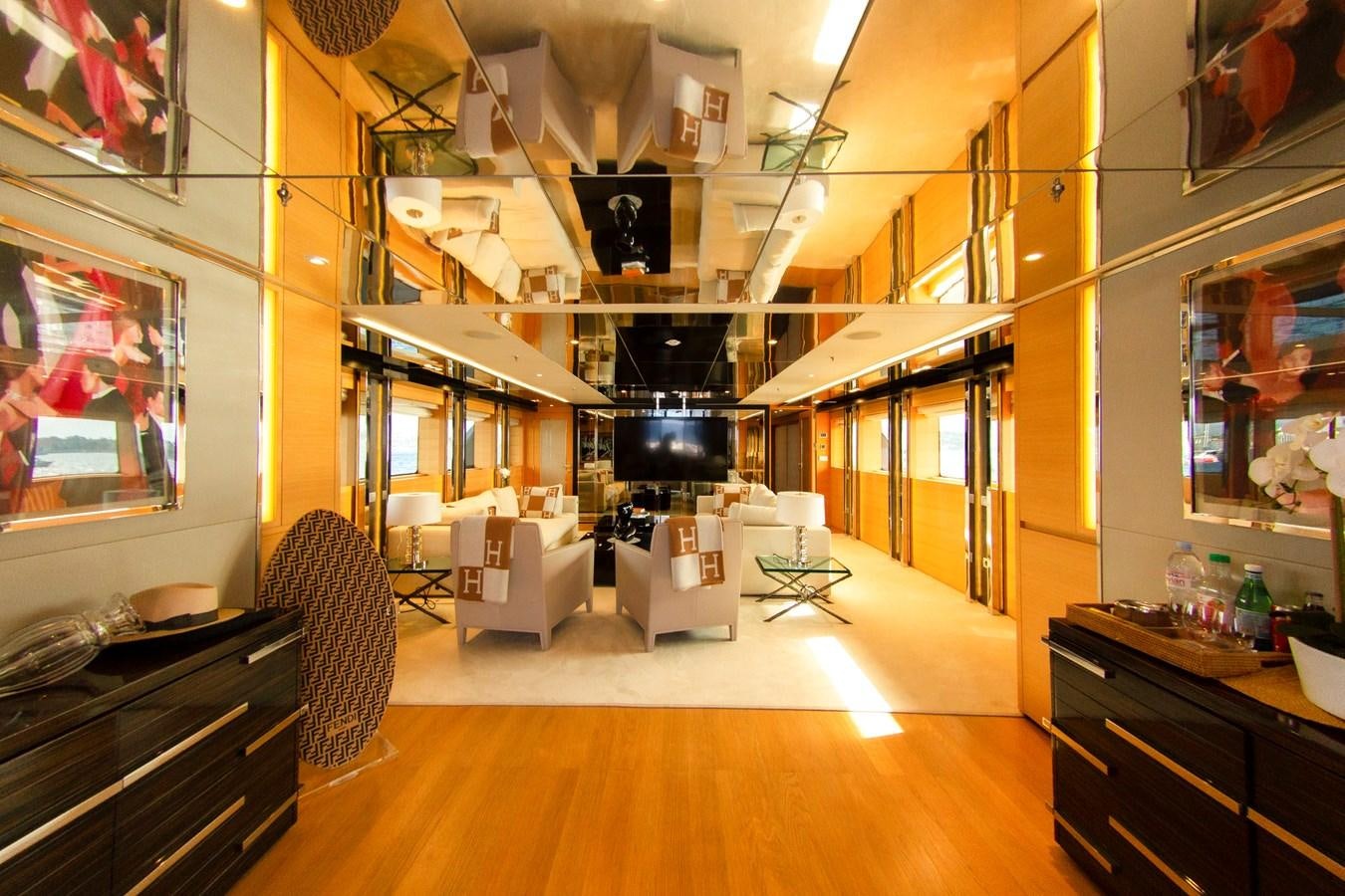 a room with a wood floor and a piano and a wood floor aboard DARLING Yacht for Sale