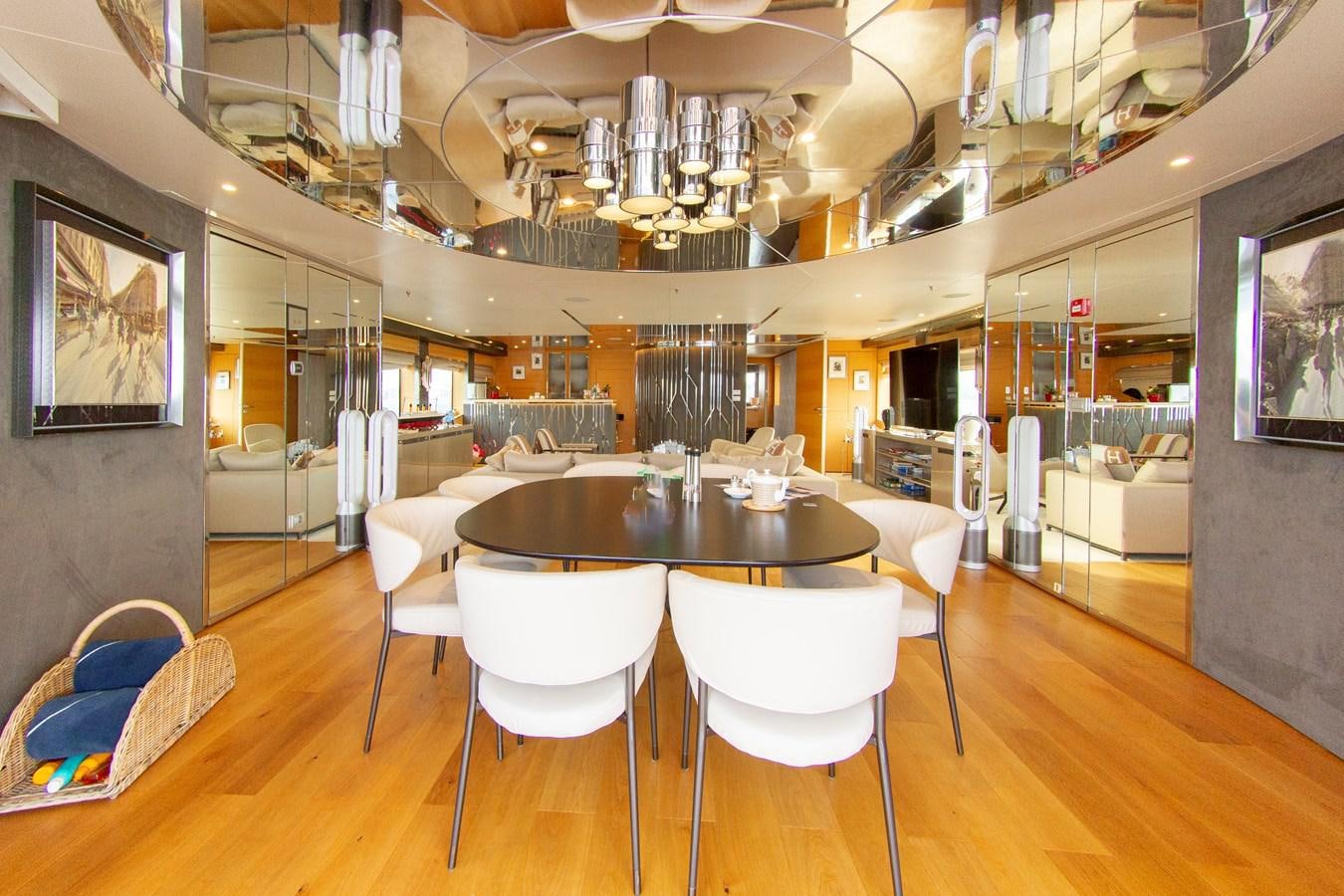 a room with a table and chairs aboard DARLING Yacht for Sale