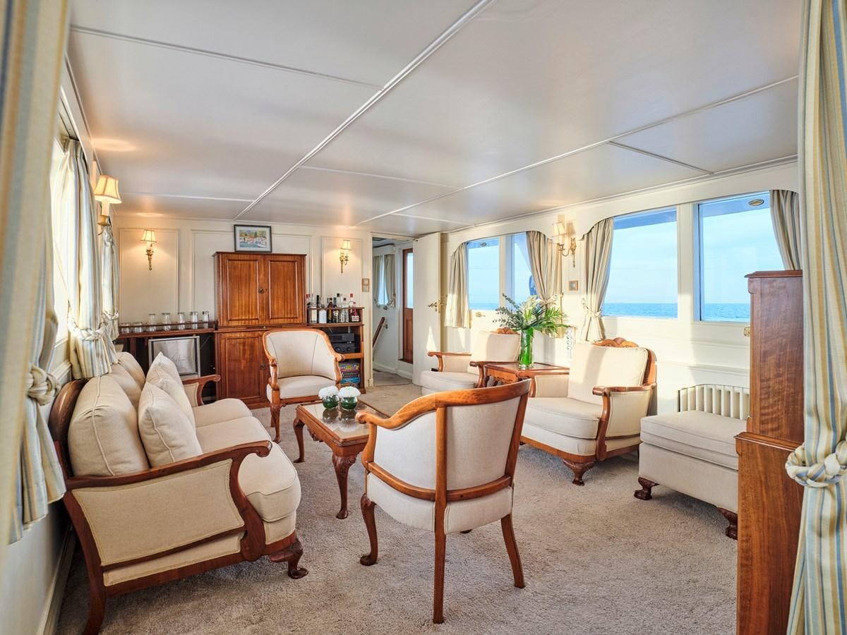 a living room with a bed and a desk aboard MIDNIGHT SUN Yacht for Sale